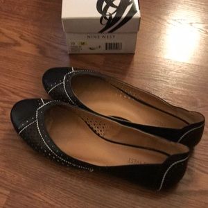 Nine West black flats with white accent